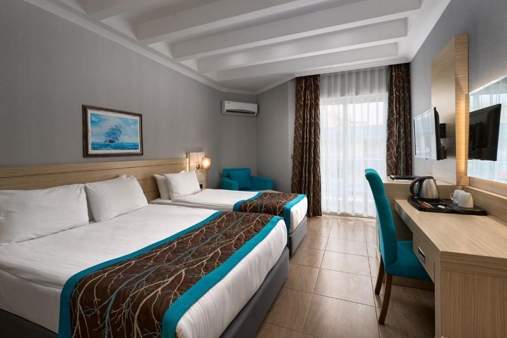 Postel nebo postele na pokoji v ubytování Kaila Beach Hotel - All Inclusive