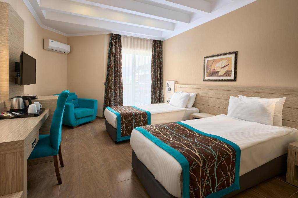 Postel nebo postele na pokoji v ubytování Kaila Beach Hotel - All Inclusive