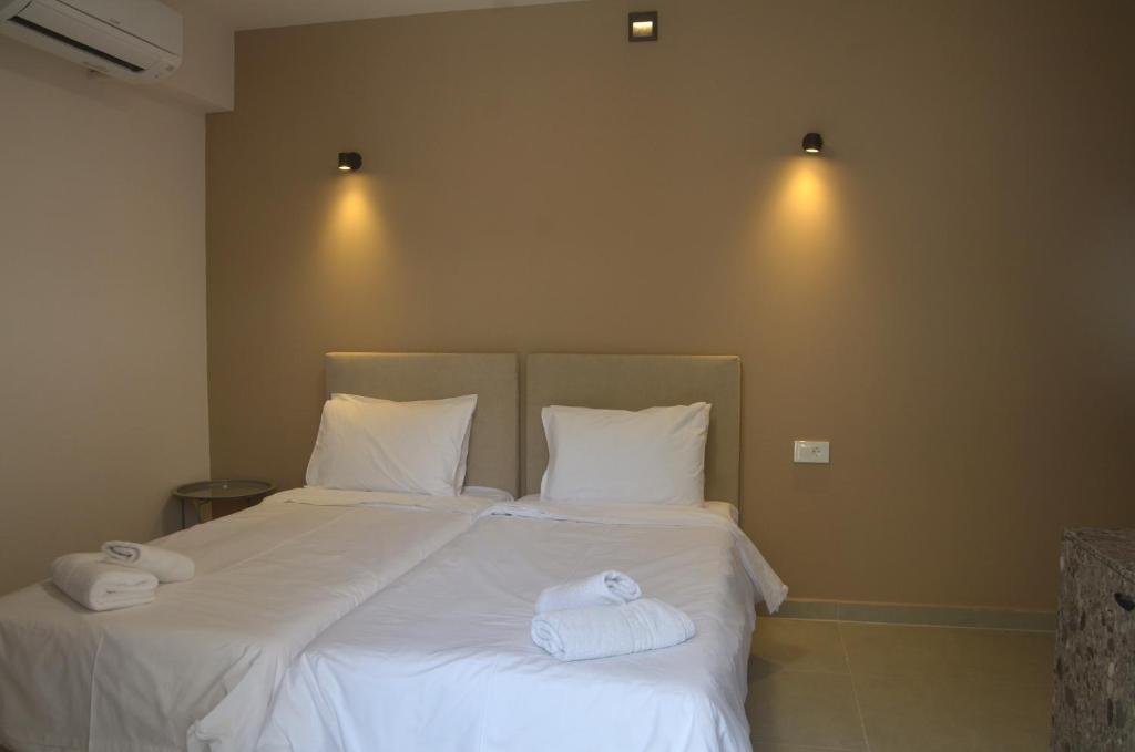 Postel nebo postele na pokoji v ubytování Centroom Suites