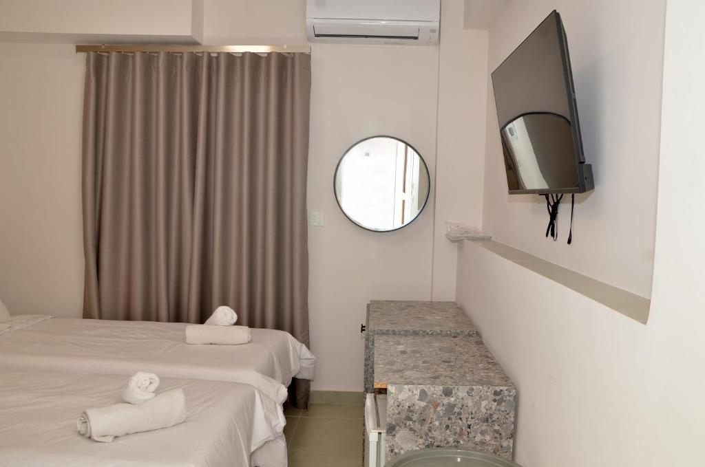 Postel nebo postele na pokoji v ubytování Centroom Suites