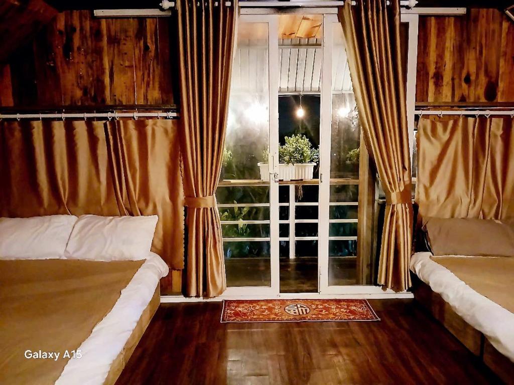 Letto o letti in una camera di Homestay Đồi Sương Trắng