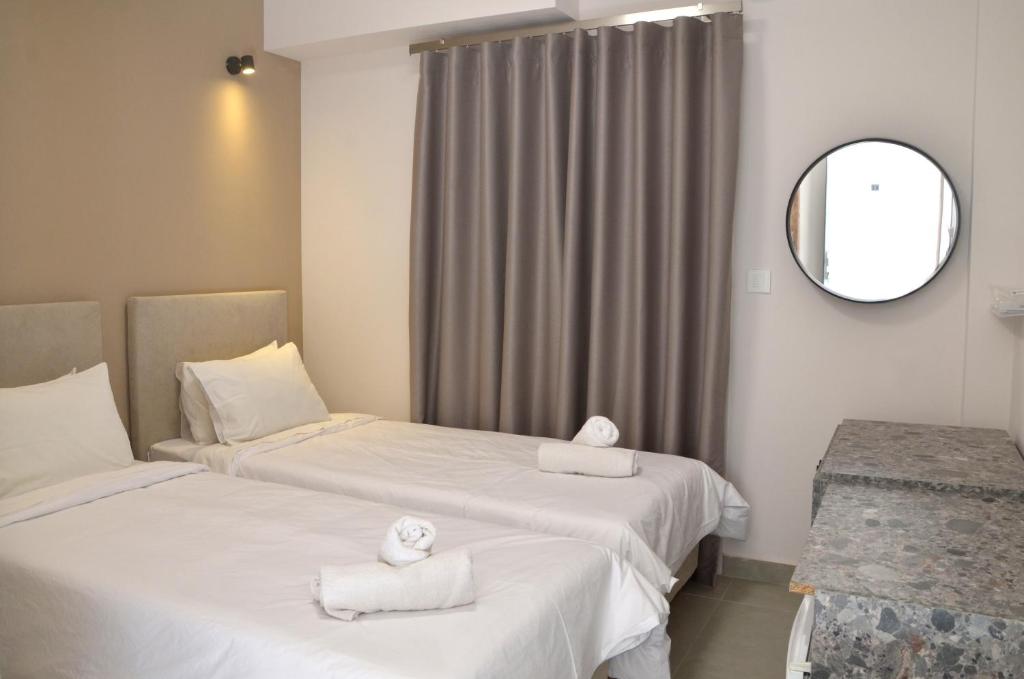 Postel nebo postele na pokoji v ubytování Centroom Suites
