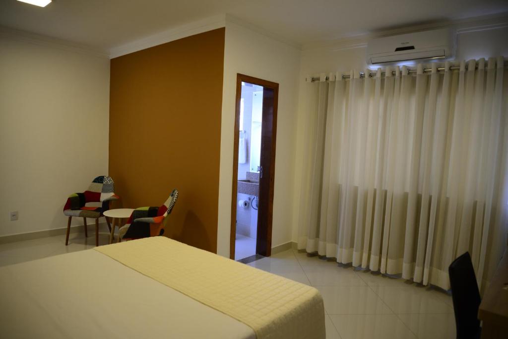 Postel nebo postele na pokoji v ubytování Granterrara Hotel