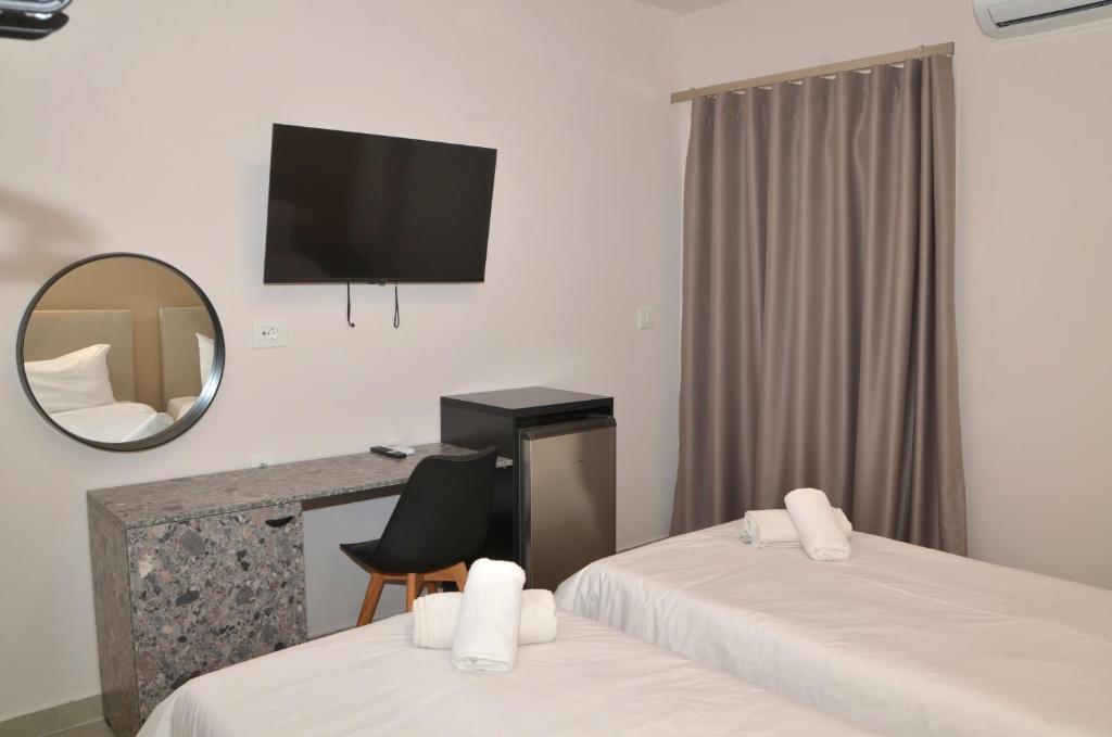 Postel nebo postele na pokoji v ubytování Centroom Suites