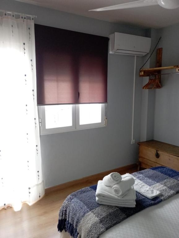 Łóżko lub łóżka w pokoju w obiekcie CASA TEO