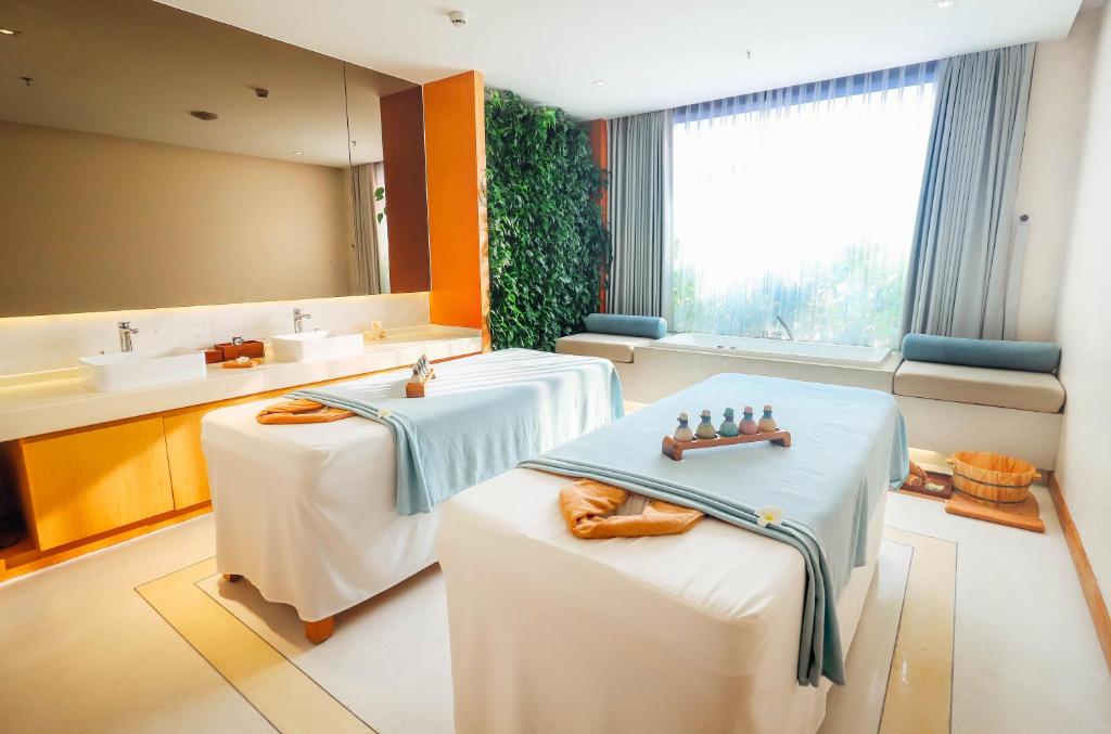 Postel nebo postele na pokoji v ubytování TMS Hotel Da Nang Beach