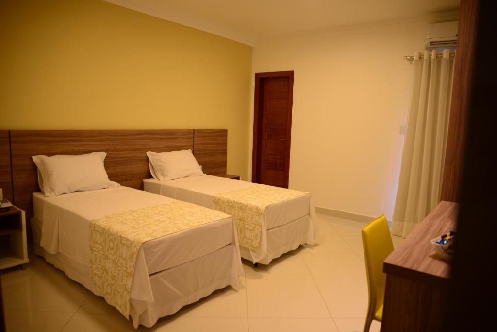 Postel nebo postele na pokoji v ubytování Granterrara Hotel
