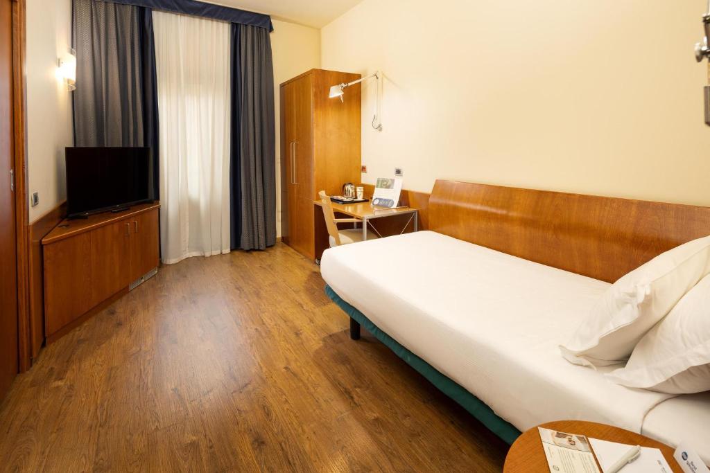 Postel nebo postele na pokoji v ubytování Best Western Hotel Luxor