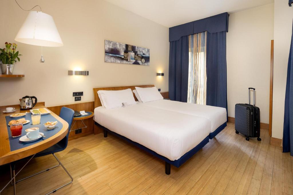 Postel nebo postele na pokoji v ubytování Best Western Hotel Luxor