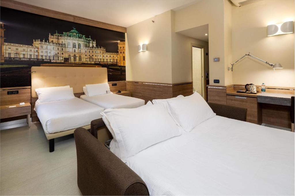 Postel nebo postele na pokoji v ubytování Best Western Hotel Luxor