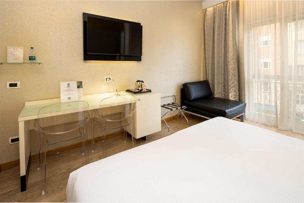 Postel nebo postele na pokoji v ubytování Best Western Hotel Luxor