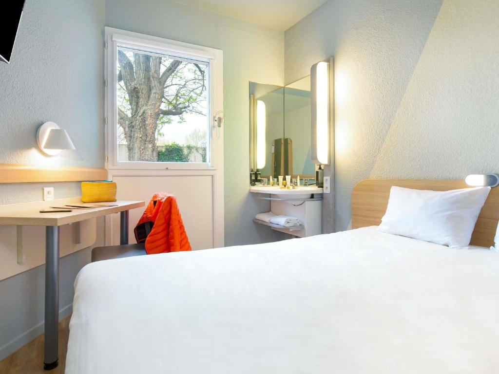 Cama o camas de una habitación en ibis budget Cavaillon