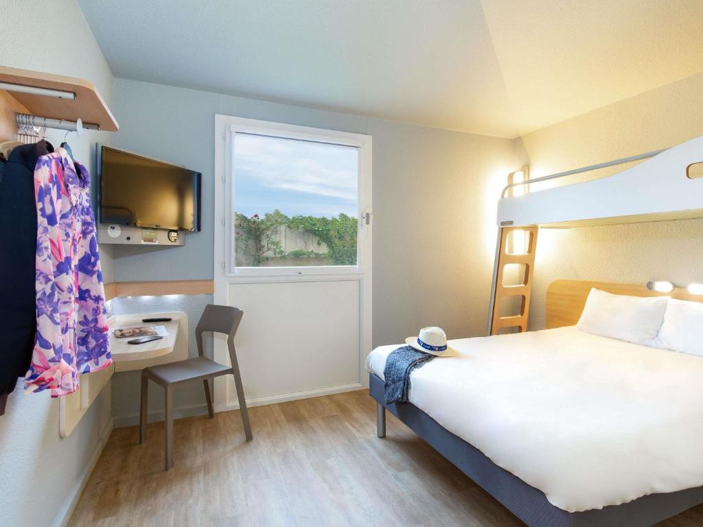 Cama o camas de una habitación en ibis budget Cavaillon