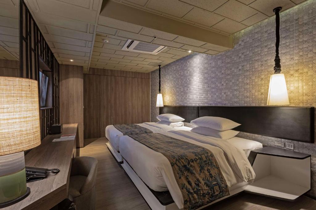 a bedroom with a large bed in a room at Siam@Siam, Design Hotel Bangkok in Bangkok