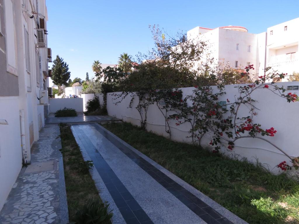 a street in a villa with a fence at Beautiful appartment with a glorious sea view in Monastir