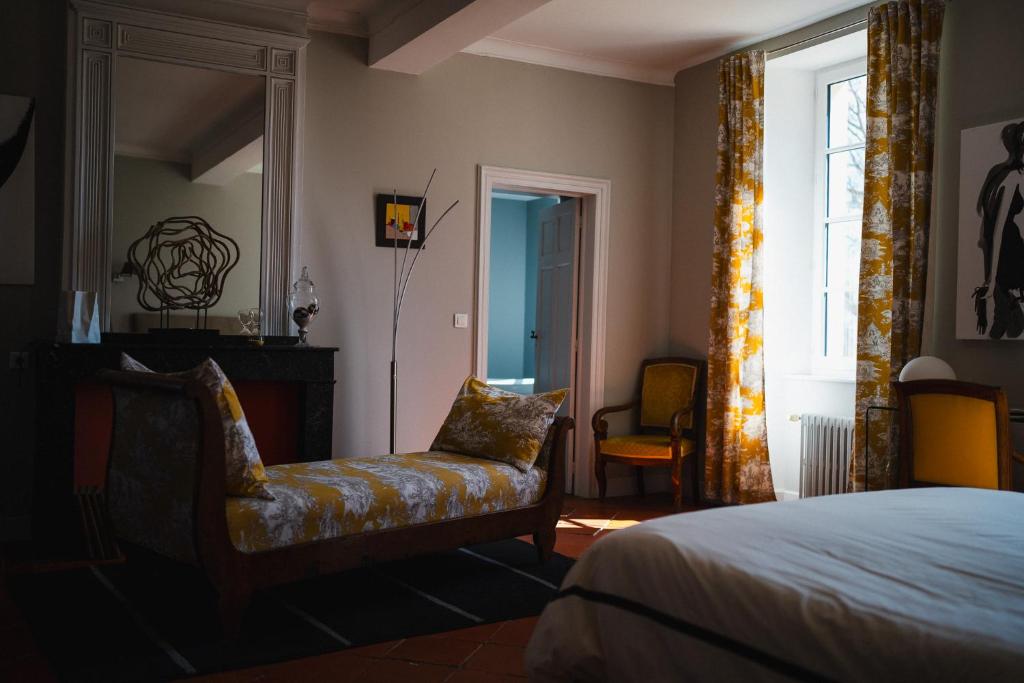 Postel nebo postele na pokoji v ubytování Château de la Bousquetarie