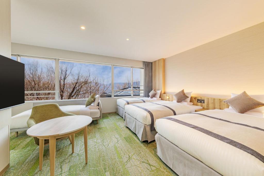 Postel nebo postele na pokoji v ubytování KAMENOI HOTEL Nagatoro Yorii