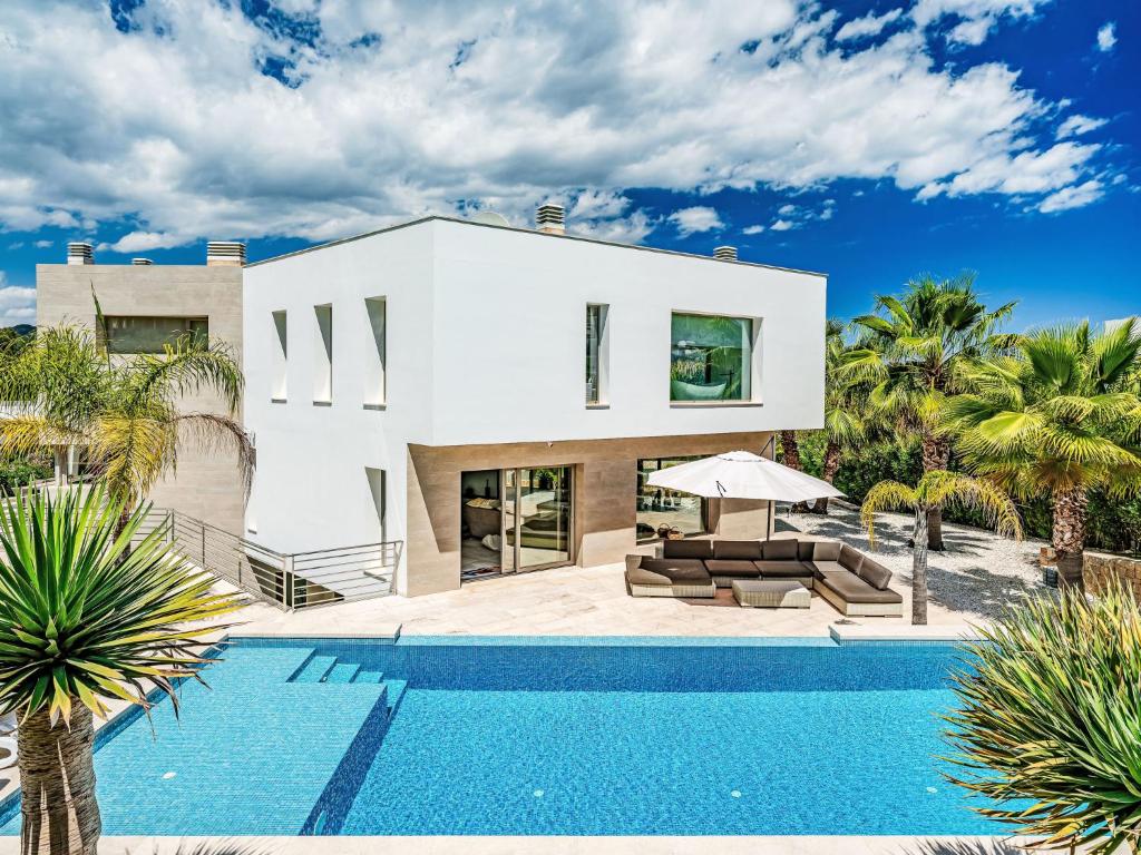 a villa with a swimming pool and a house at Villa Villa Eos by Interhome in Jávea