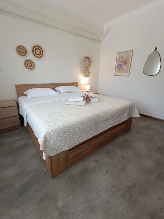 A bed or beds in a room at Sea View Palio Apartment
