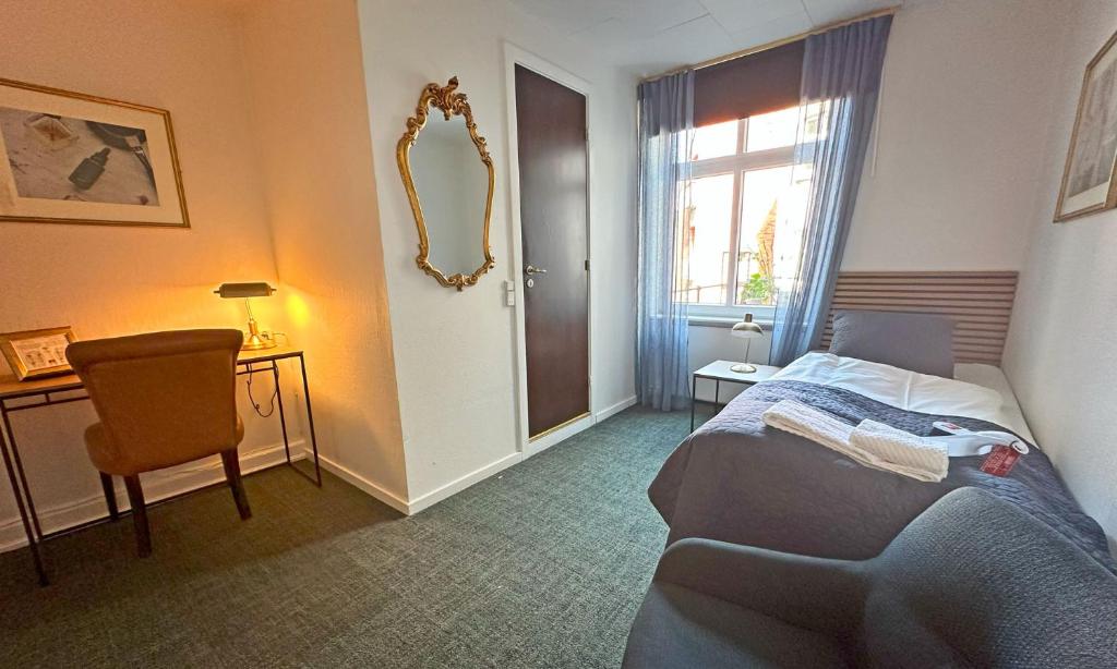 Postel nebo postele na pokoji v ubytování Milling Hotel Windsor