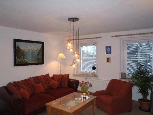 a living room with a couch and a table at Erzgebirge in Johanngeorgenstadt