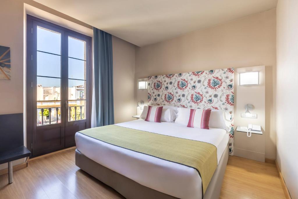 Postel nebo postele na pokoji v ubytování Itaca Jerez by Soho Boutique