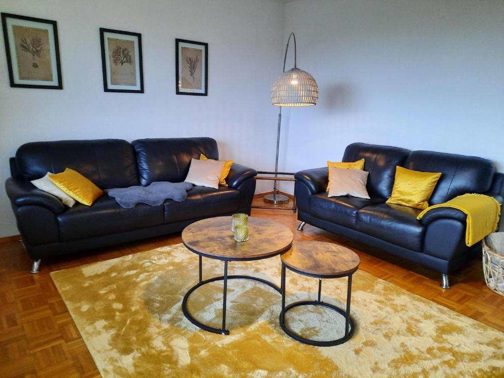 a living room with a couch and a table at Ferienwohnung Idyll Mit Loggia Und Garten in Welferode