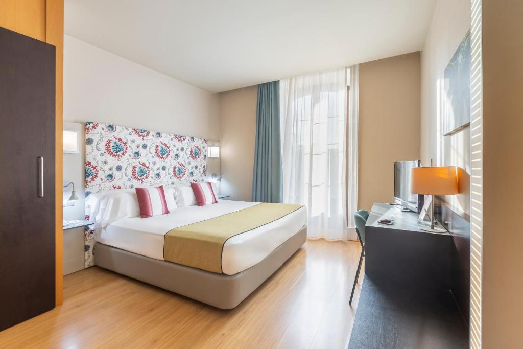 Postel nebo postele na pokoji v ubytování Itaca Jerez by Soho Boutique
