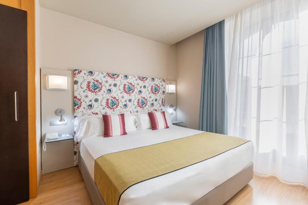 Postel nebo postele na pokoji v ubytování Itaca Jerez by Soho Boutique