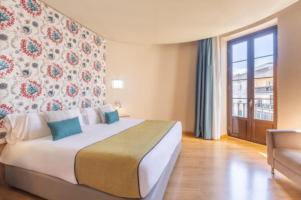 Postel nebo postele na pokoji v ubytování Itaca Jerez by Soho Boutique
