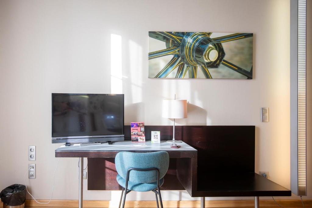 TV a/nebo společenská místnost v ubytování Itaca Jerez by Soho Boutique