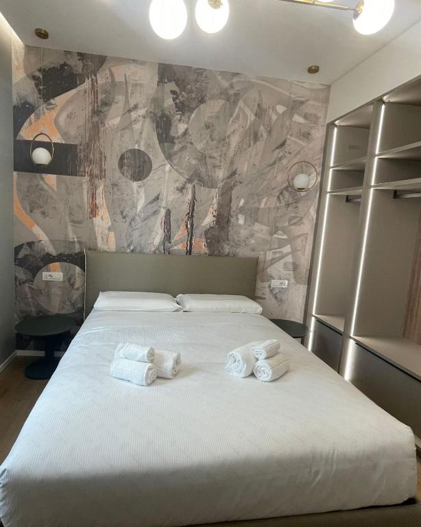 Postel nebo postele na pokoji v ubytování Maison Rasella Palace Suites