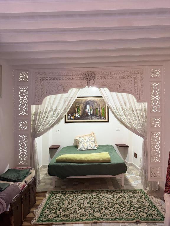 Ліжко або ліжка в номері Suite Iskander Persane
