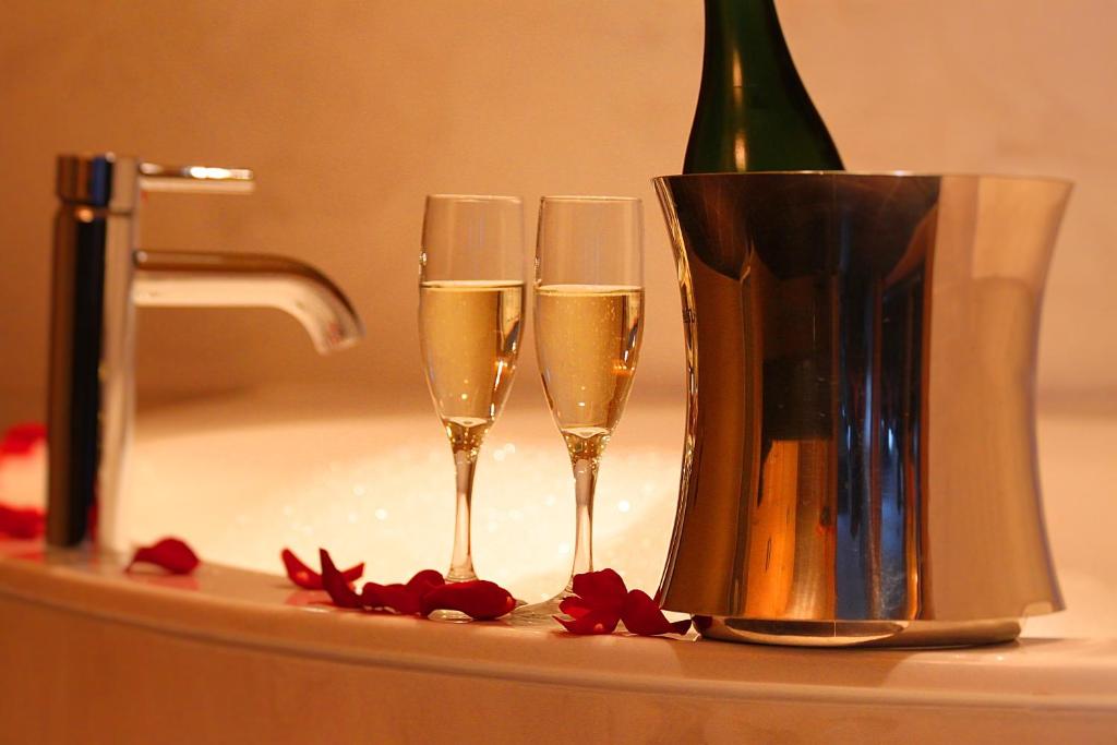 two glasses of champagne and a bottle of wine at Century Casino & Hotel Edmonton in Edmonton