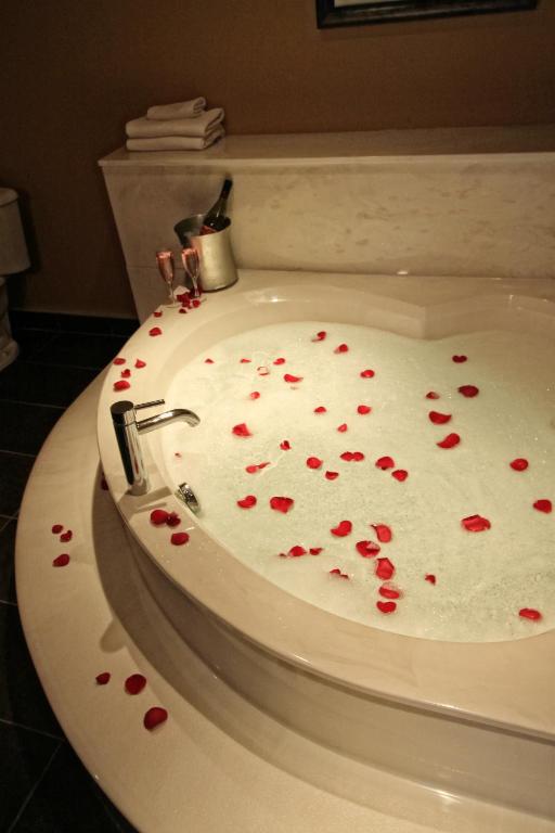 a white cake with red hearts on a toilet at Century Casino & Hotel Edmonton in Edmonton