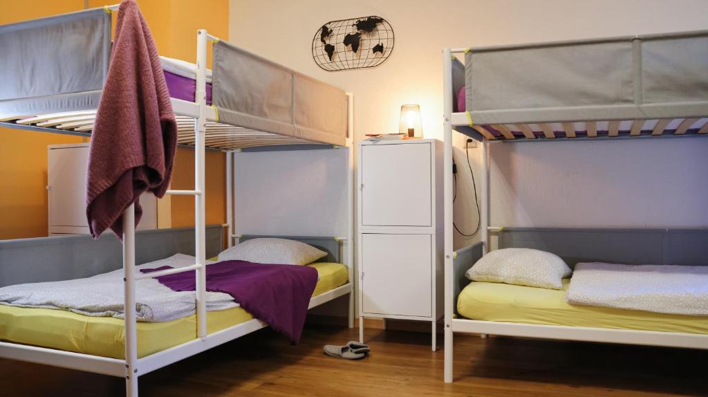 Postel nebo postele na pokoji v ubytování Backpacker Le Petit Baroudeur