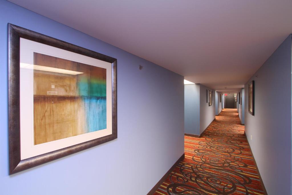 a hallway with paintings on the walls at Century Casino & Hotel Edmonton in Edmonton