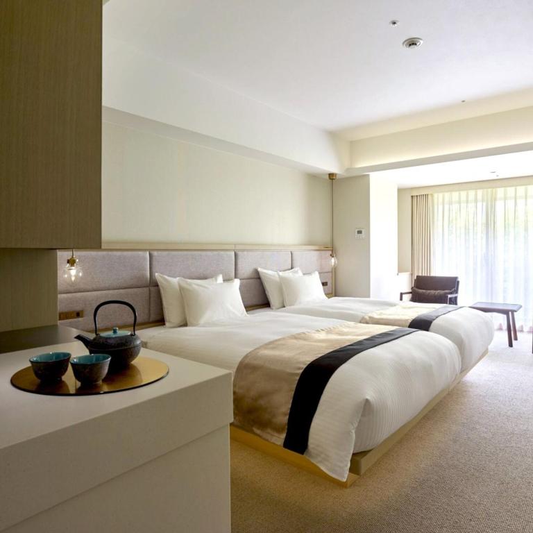 Postel nebo postele na pokoji v ubytování Hotel Atlantiis Suites Near IGI Airport