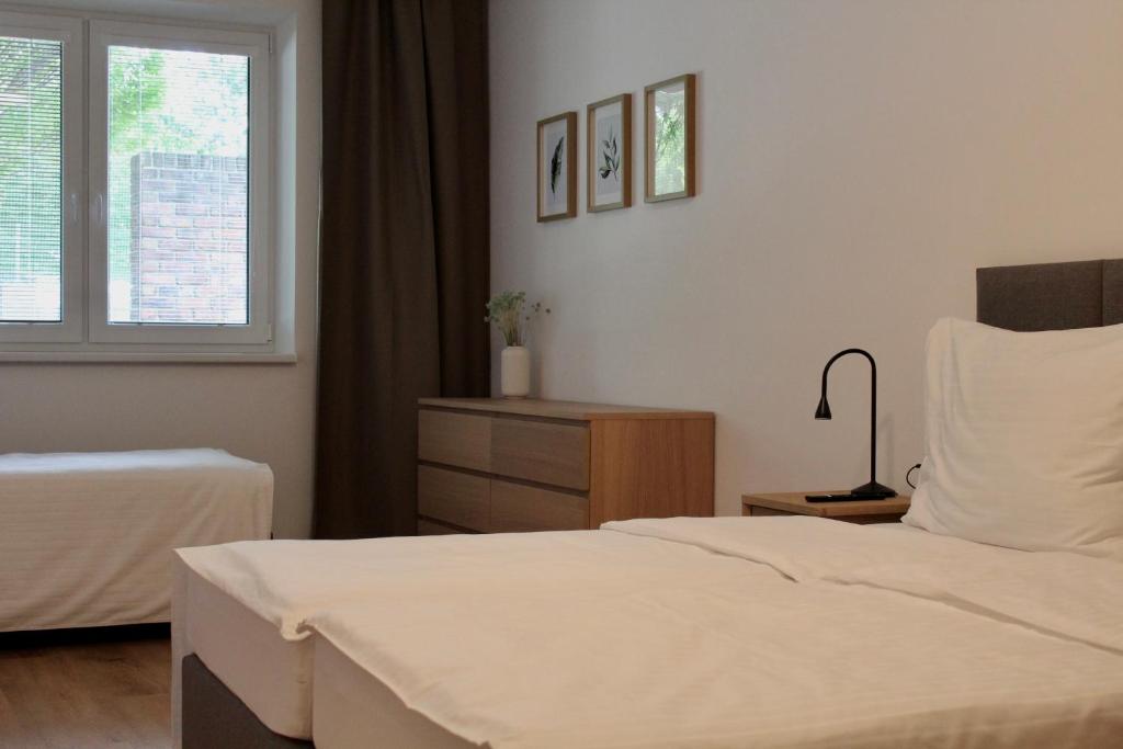 Giường trong phòng chung tại Apartmány Abacie