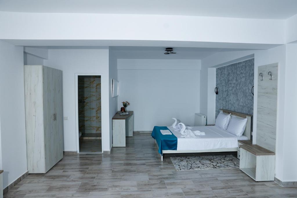 Postel nebo postele na pokoji v ubytování RUXO Hotel