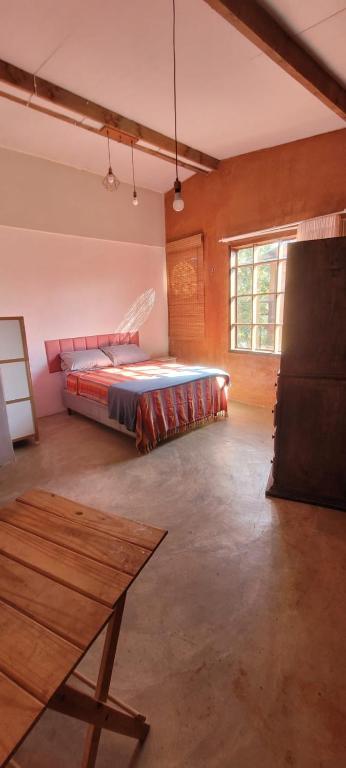 Postel nebo postele na pokoji v ubytování Vila Kuir Hospedagens