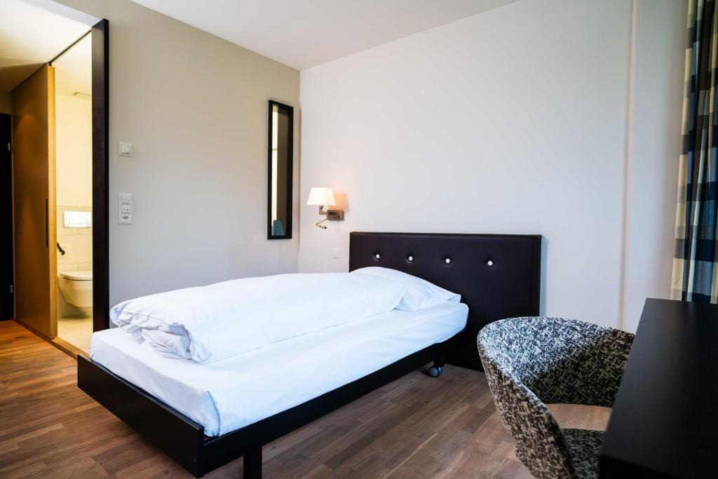 Voodi või voodid majutusasutuse Hotel Seepark Thun toas