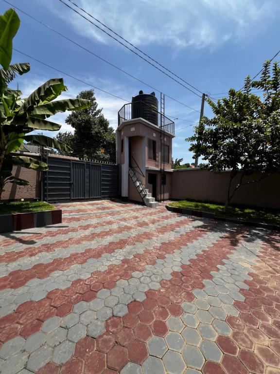 a brick driveway in front of a house at Hadraj Moshono Apartment2 in Arusha