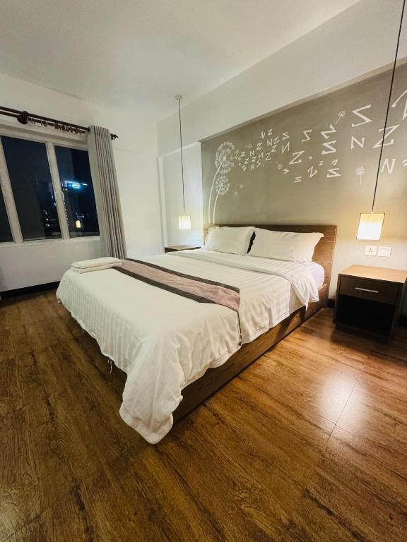 Postel nebo postele na pokoji v ubytování Asiban Quay Boutique Hotel