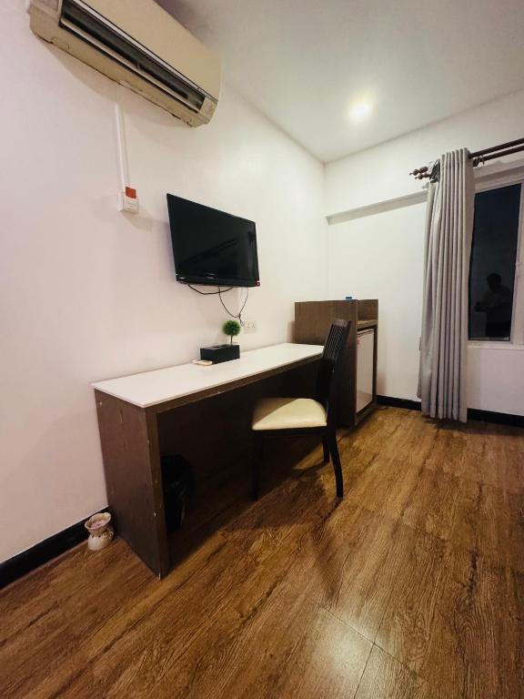 TV a/nebo společenská místnost v ubytování Asiban Quay Boutique Hotel