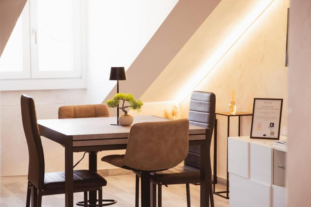 a dining room with a table and chairs at Piazza Vittorio Luxury View in Turin