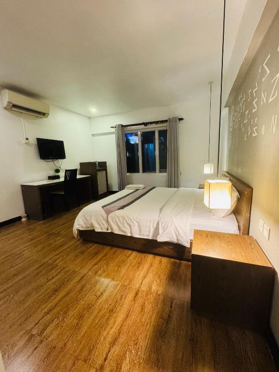 Postel nebo postele na pokoji v ubytování Asiban Quay Boutique Hotel