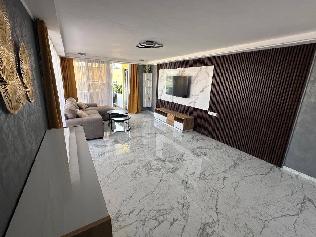 a living room with a marble floor at Emerald Luxe in Ayia Napa