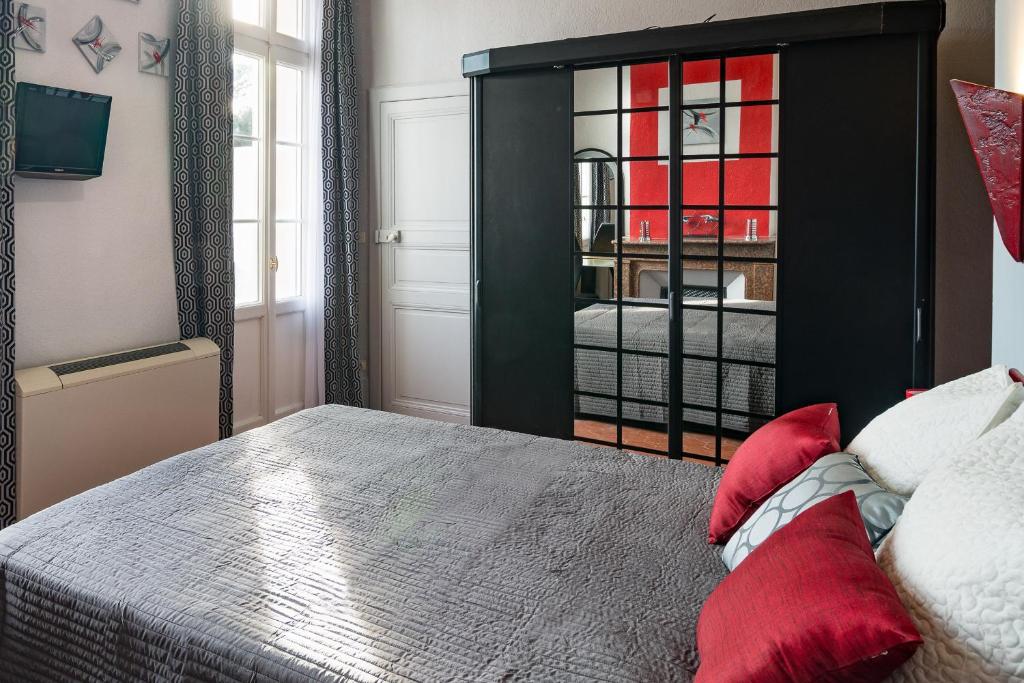 Postel nebo postele na pokoji v ubytování B&B Le Logis Du Mas