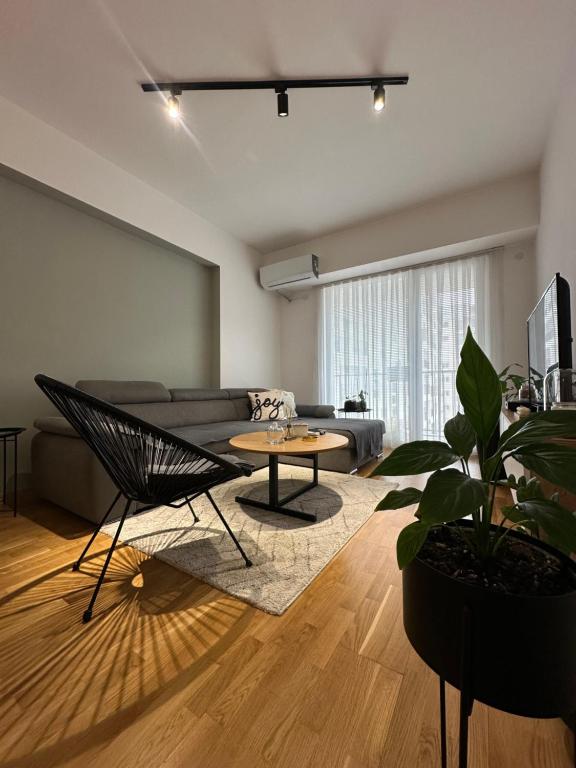 a living room with a couch and a table at Home apartment in Skopje